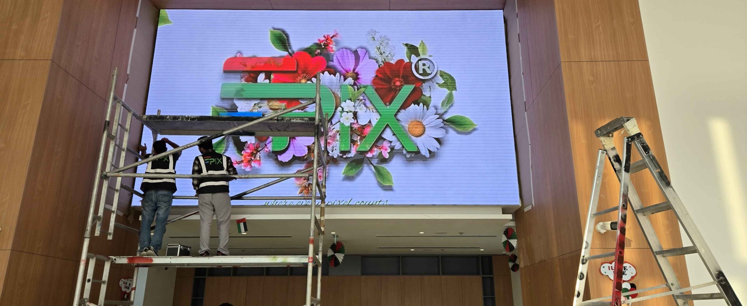 LED screen installation in progress at American Impact School Sharjah