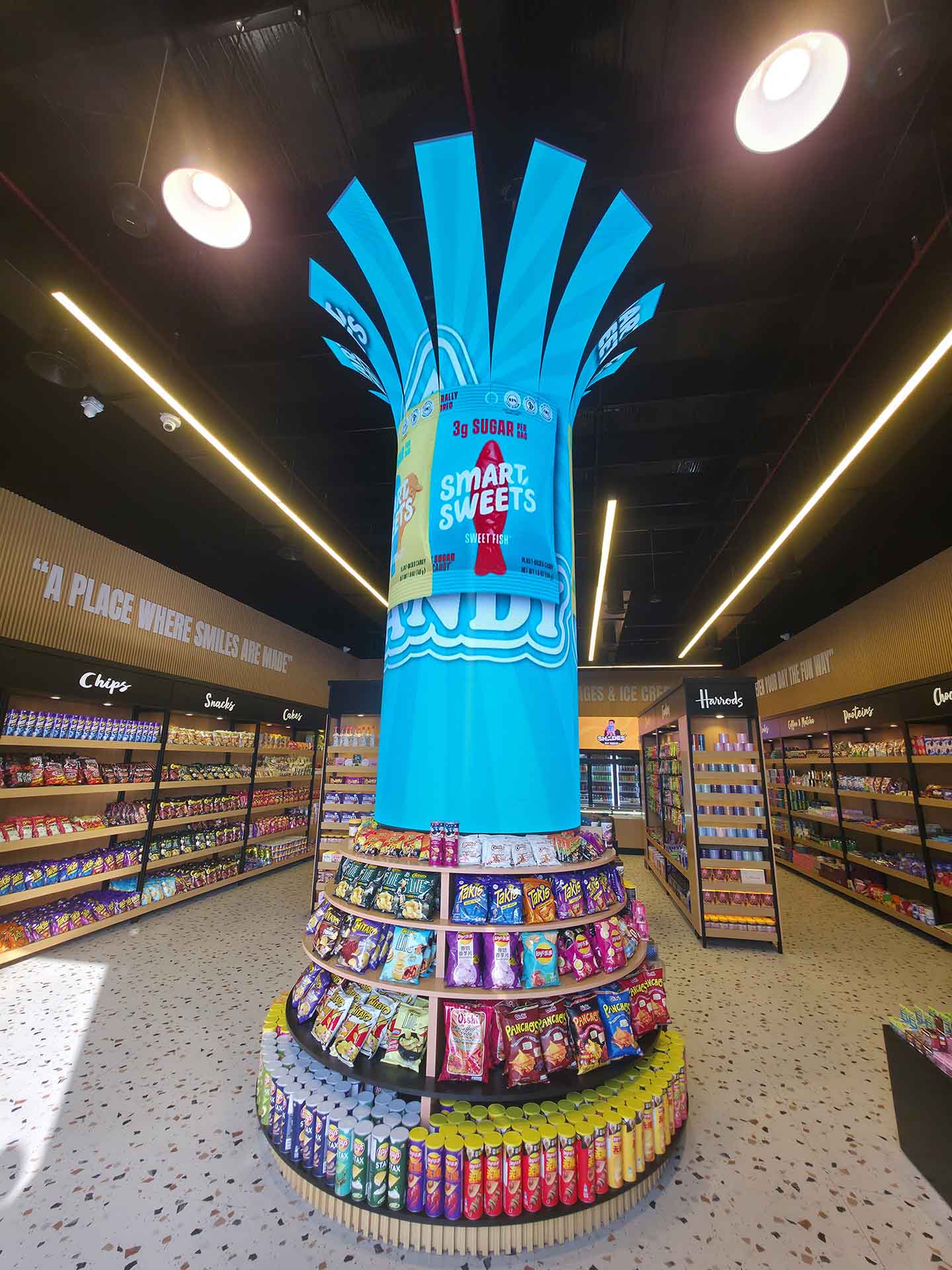 Date palm tree-shaped LED screen with cylindrical trunk and illuminated branches at EZ Candy Dubai